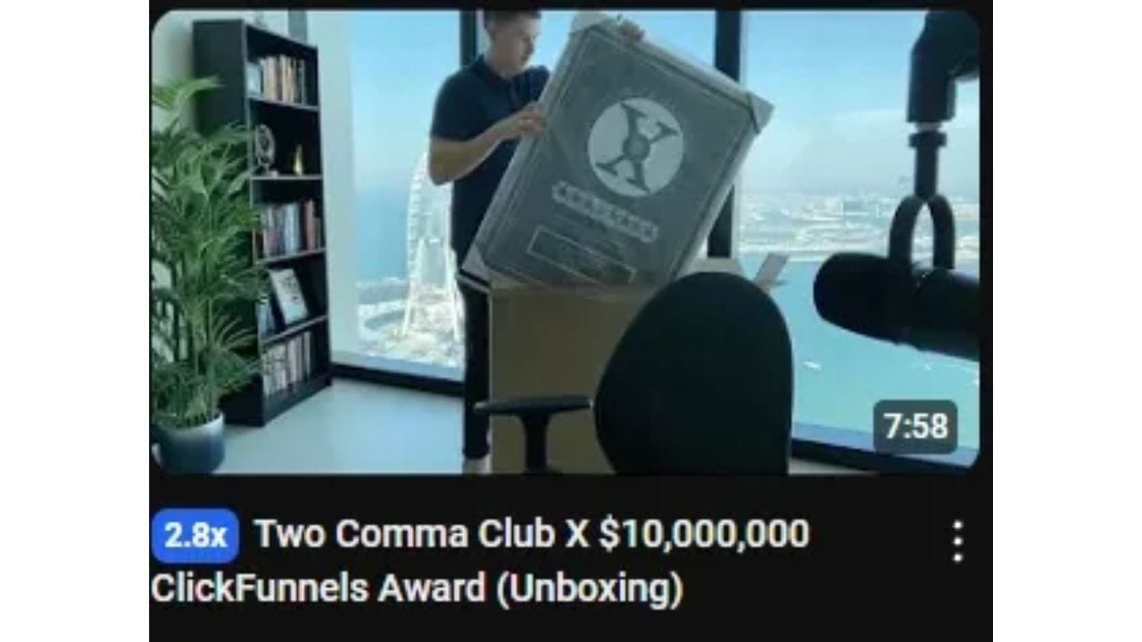 A YouTube video thumbnail showing a man unboxing a large package with the ClickFunnels logo.