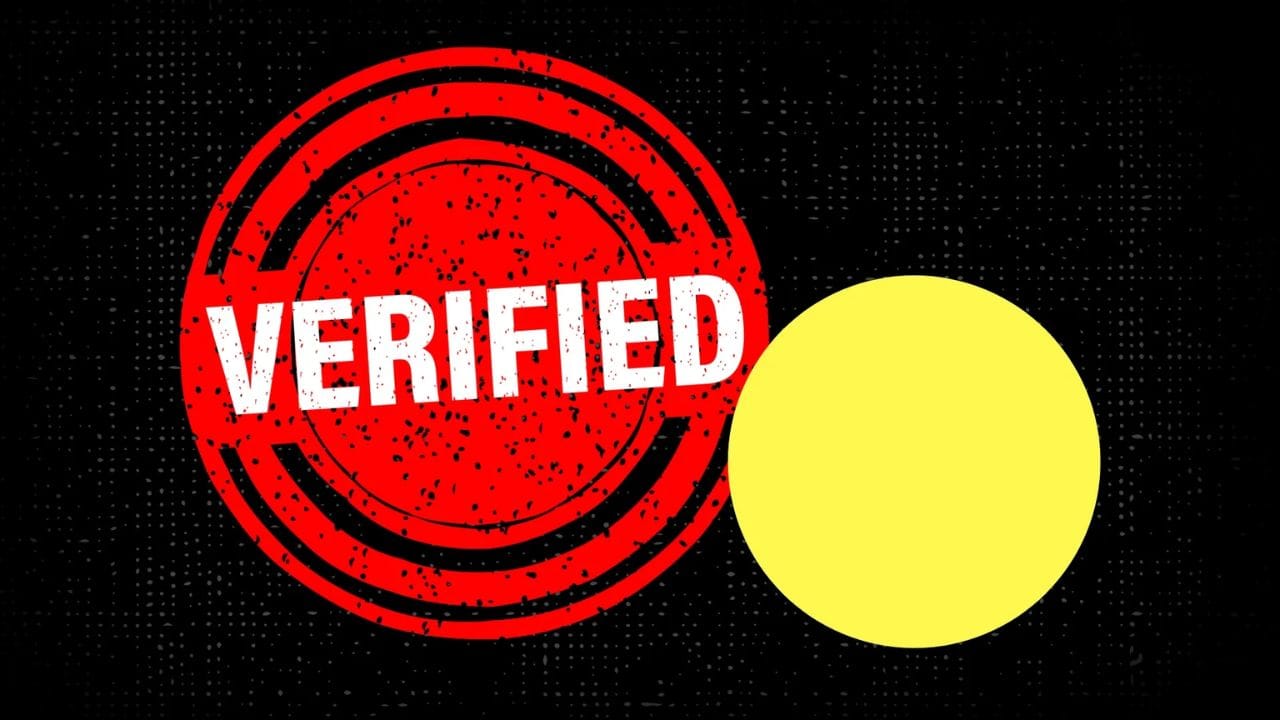 A red circular stamp with the word "VERIFIED" in white text, placed on top of a yellow circle on a black background.