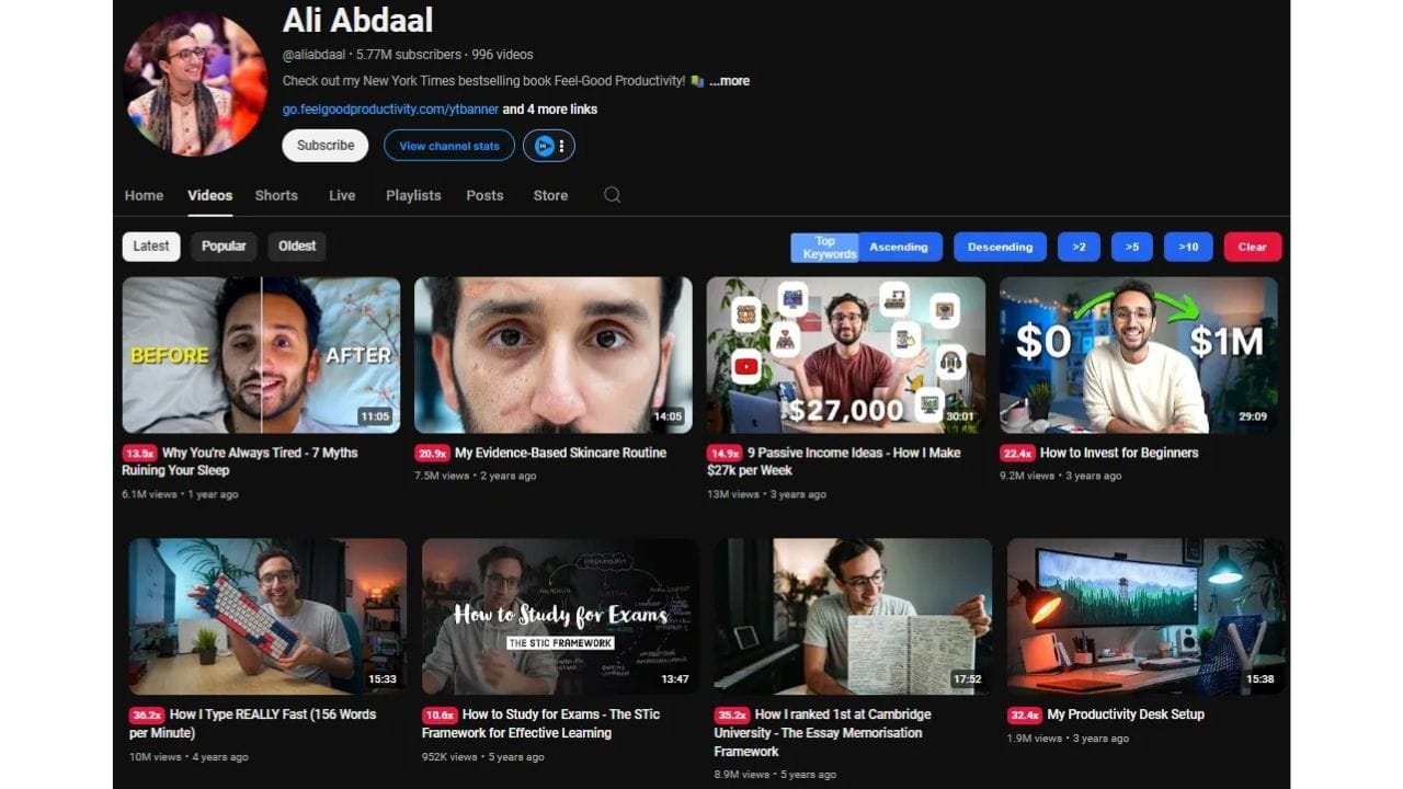A screenshot of Ali Abdaal's YouTube channel page, featuring popular videos such as "Why You're Always Tired," "How to Invest for Beginners," and "How to Study for Exams." The channel's banner showcases a book cover and a call to action to visit a website.