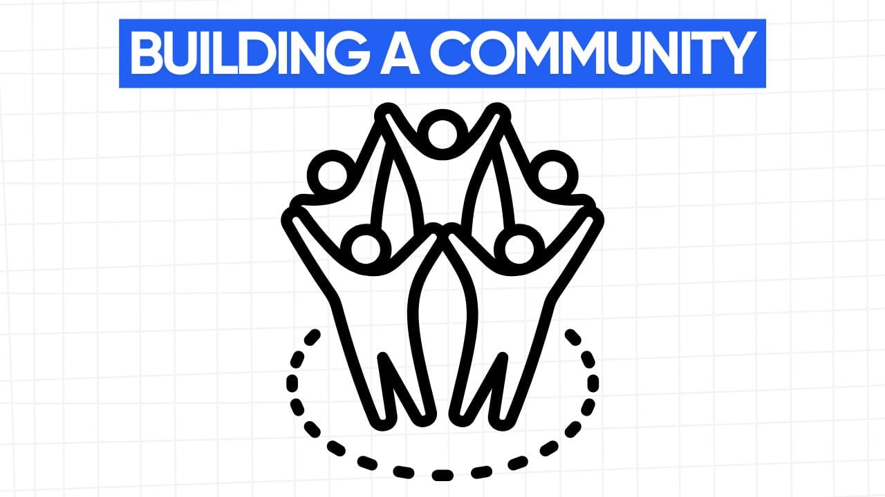 A line art drawing of five stick figures with raised arms forming a connected group within a dotted circle. Above the figure graphic is a blue banner with the text "BUILDING A COMMUNITY" in white letters. The background is a light gray grid pattern.