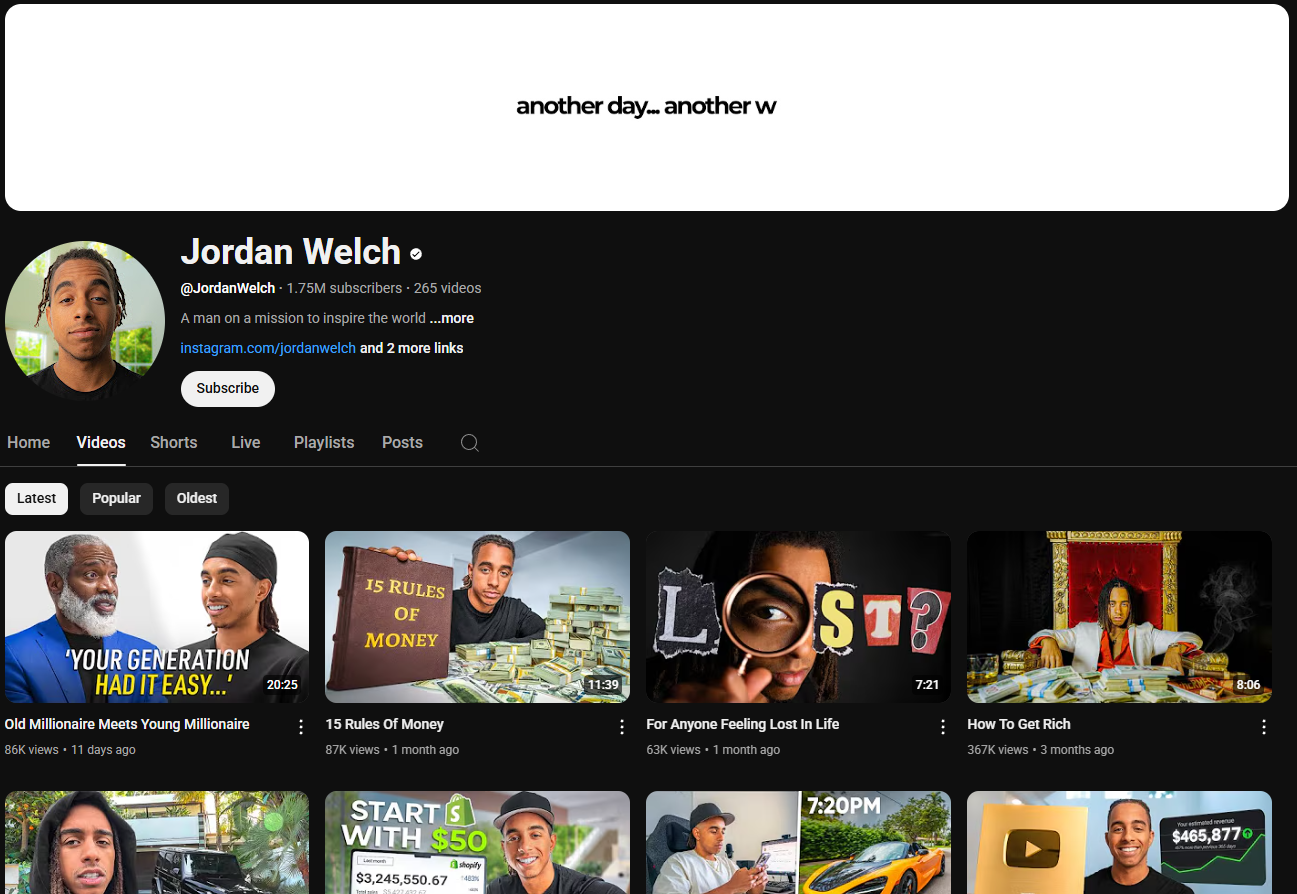 A dark-themed YouTube channel page for Jordan Welch. The channel banner is a simple dark background with the beginning of the phrase "another day... another w" visible at the top. The profile picture shows Jordan Welch smiling. The channel name "Jordan Welch" is in white letters, followed by a black dot. Below is the channel username "@JordanWelch", the subscriber count (1.75 million), and the video count (265). The banner also includes the text "A man on a mission to inspire the world ...more", a link to his Instagram account, and a "Subscribe" button. The channel page displays tabs for "Home," "Videos," "Shorts," "Live," "Playlists," "Posts," and a search icon. Below these tabs are sorting options for "Latest," "Popular," and "Oldest." The video thumbnails feature Jordan Welch and various visuals related to money and success, with titles like "Old Millionaire Meets Young Millionaire," "15 Rules Of Money," "For Anyone Feeling Lost In Life," and "How To Get Rich."