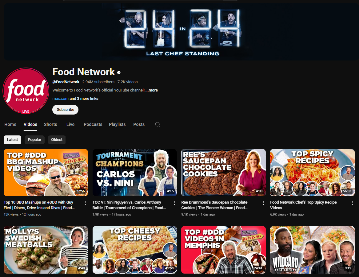 A dark-themed YouTube channel page for Food Network. The channel banner features a countdown timer displaying "24 : 24" and the text "IN LAST CHEF STANDING." The profile picture is the red Food Network logo. The channel name "Food Network" is in white letters, followed by a black dot. Below is the channel username "@FoodNetwork", the subscriber count (2.94 million), and the video count (7.2K). The banner also includes a brief welcome message and links to their website and other platforms, along with a "Subscribe" button. The channel page displays tabs for "Home," "Videos," "Shorts," "Live," "Podcasts," "Playlists," "Posts," and a search icon. Below these tabs are sorting options for "Latest," "Popular," and "Oldest." The video thumbnails feature clips and highlights from various Food Network shows and chefs, including Guy Fieri ("Diners, Drive-ins and Dives"), "Tournament of Champions" (featuring Carlos vs. Nini), Ree Drummond ("The Pioneer Woman"), and collections of recipes ("Top Spicy Recipes," "Top Cheesy Recipes"). The view counts and upload dates vary across the videos.